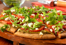 Umami-Bomb Pizza with Arugula, Heirloom Tomatoes & Goat Cheese