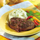 Swanson® Peppercorn-Seasoned Steaks with Mustard-Wine Sauce